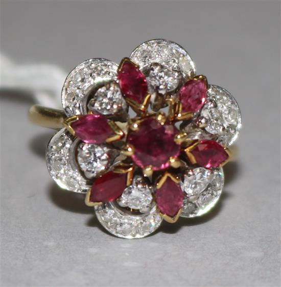 A yellow metal ruby and diamond cluster dress ring, size H.